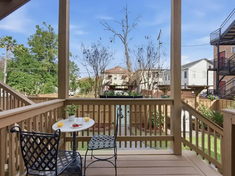 Suite 314A private deck at Forsyth Park vacation rental Savannah — bistro table chairs garden view morning coffee