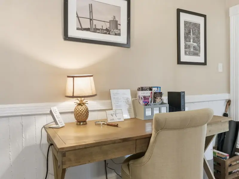 Suite 314A dedicated workspace at Savannah vacation rental — wooden desk Savannah art prints 279 Mbps WiFi