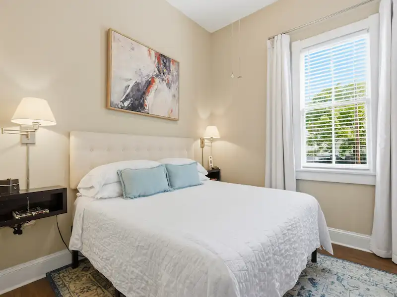 Suite 316A kitchen under cabinet lighting and subway tile backsplash — Victorian District rental Savannah